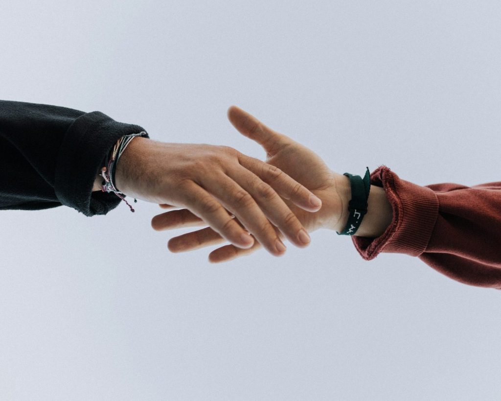 view of two persons hands